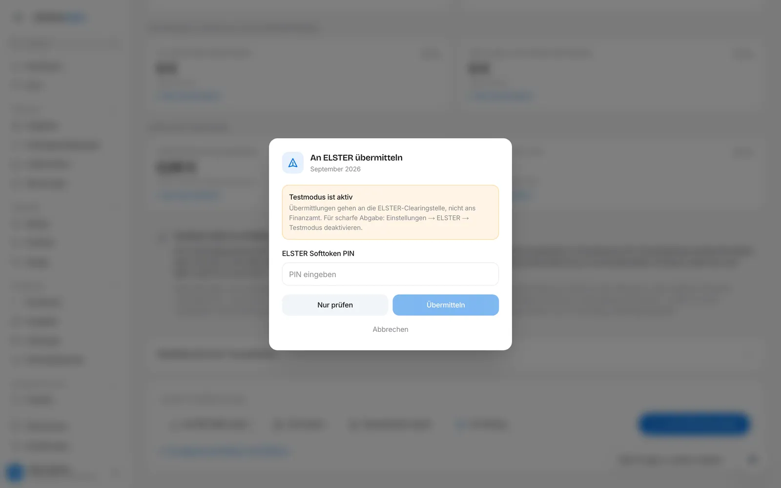 Dialog „An ELSTER übermitteln" mit Testmodus-Hinweis, PIN-Feld und den Knöpfen „Nur prüfen" und „Übermitteln"